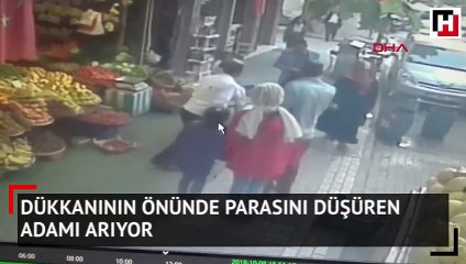 Dükkanının önünde parasını düşüren adamı arıyor