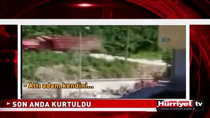 DEVRİLEN KAMYONDAN SON ANDA KURTULDU