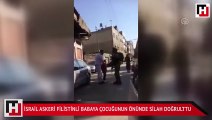 İsrail askeri Filistinli babaya çocuğunun önünde silah doğrulttu