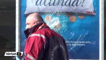 Baltayla banka şubesinin camını kırdı