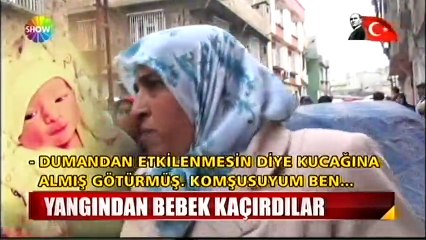 Yangından bebek kaçırdı
