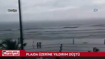 Plajda kadının üzerine yıldırım düştü