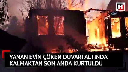 Yanan evin çöken duvarı altında kalmaktan son anda kurtuldu