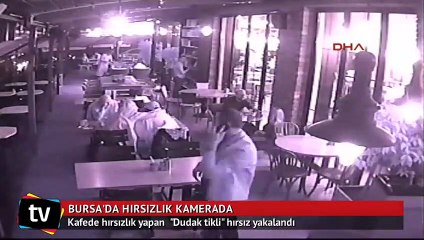 Kafede cüzdan çalan "dudak tikli" hırsız yakalandı