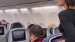 Anger on the plane - Upset Passenger Throws Water Bottle on Plane -- World Virals