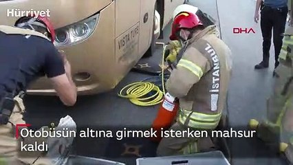 Otobüsün altına girmek isterken mahsur kaldı