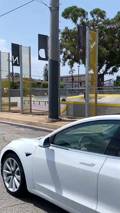 BMX rider jumps ramp at skatepark over fence then handlebar hits large pole