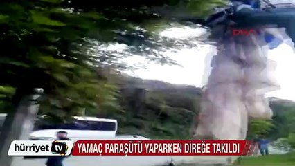 Yamaç paraşütü yaparken direğe takıldı