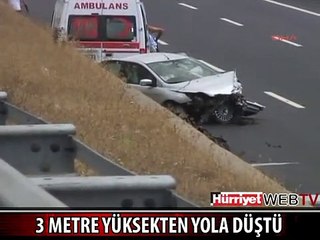 OTOMOBİL 3 METRE YÜKSEKTEN YOLA DÜŞTÜ