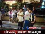 GENÇ KIZ LÜKS ARACIYLA TREN RAYLARINA UÇTU