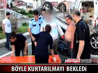TERS DÖNEN ARAÇTA KURTARILMAYI BEKLEDİ