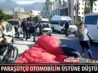 PARAŞÜTÇÜ OTOMOBİLİN ÜSTÜNE DÜŞTÜ