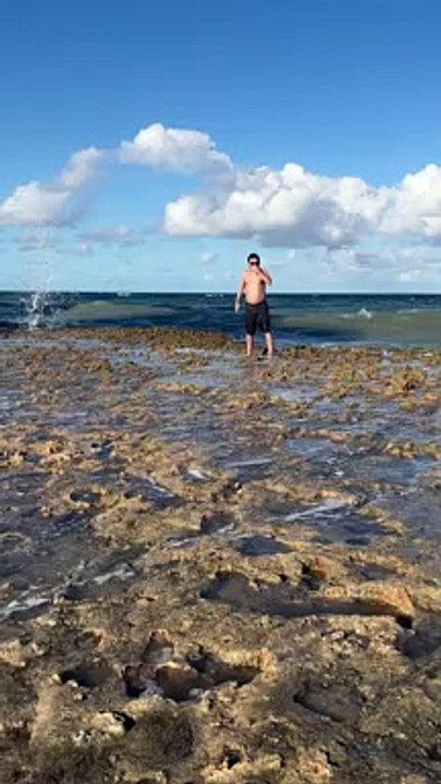 Big Wave Plows Over Man on Beach