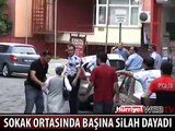 SOKAK ORTASINDA BAŞINA SİLAH DAYADI
