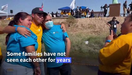 Migrant families briefly reunite under "Hugs not walls" program at Mexico-US border