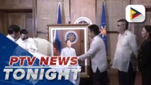 President Ferdinand R. Marcos receives portrait from artist Alvin Hipolito