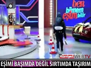 BEN EŞİMİ BAŞIMDA DEĞİL SIRTIMDA TAŞIRIM