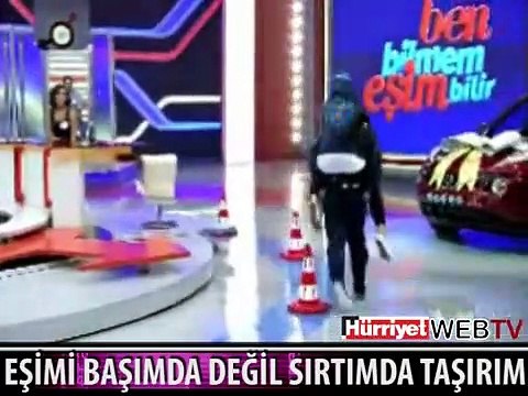 BEN EŞİMİ BAŞIMDA DEĞİL SIRTIMDA TAŞIRIM