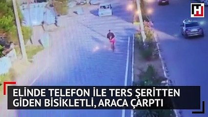 Elinde telefon ile ters şeritten giden bisikletli, araca çarptı