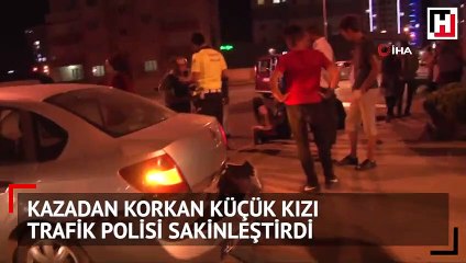 Kaza sonrasında korkan küçük kızı trafik polisi sakinleştirdi