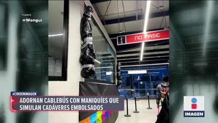 Adornan estación de cablebús con "cuerpos" embolsados