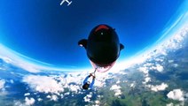 Skydiver hangs on to wingsuit pilot flying at speeds of up to 145mph in incredible footage