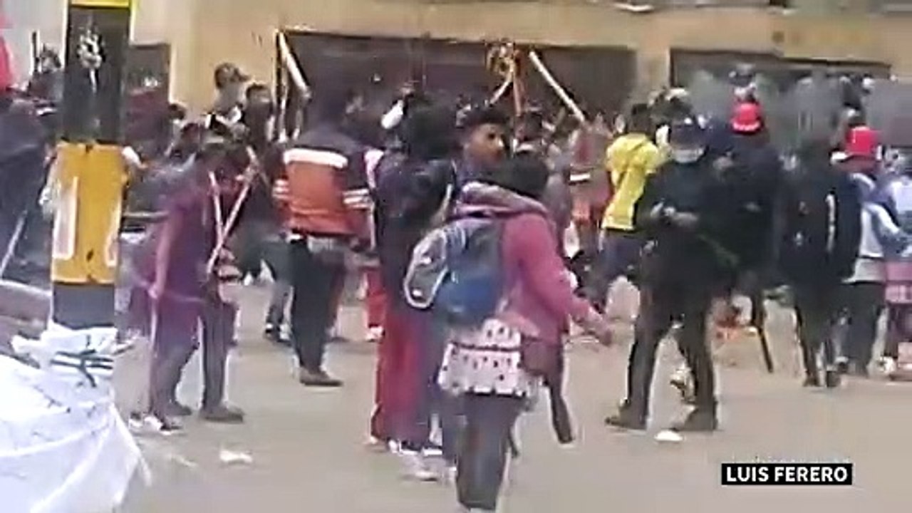 Indigenous protesters and riot police clash in Bogota