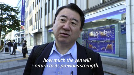 Japanese react to weakening yen after it falls to lowest since 1990