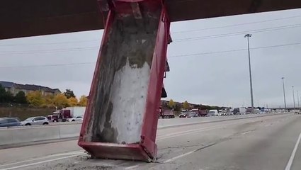 Dump truck box gets stuck vertically under Canadian overpass