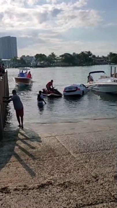 Car Drives into Water at Boat Ramp Almost Sinking Car
