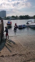 Car Drives into Water at Boat Ramp Almost Sinking Car