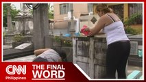 Families clean up graves at Manila North Cemetery