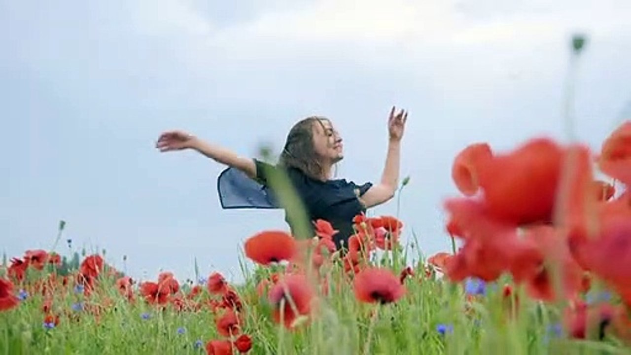 Gadismenaridikebunbungamixkit-girl-dancing-happily-in-a-field-of-flowers-4702-medium