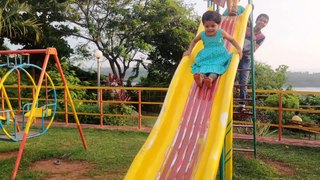 Cute smiling baby playing on see saw