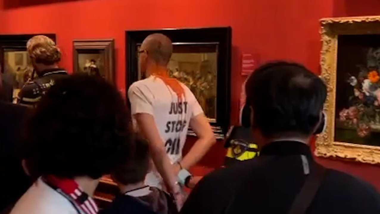 Protester wearing Just Stop Oil t-shirt led away after targeting Girl With a Pearl Earring