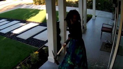 Woman smashes windows of California home with pickaxe