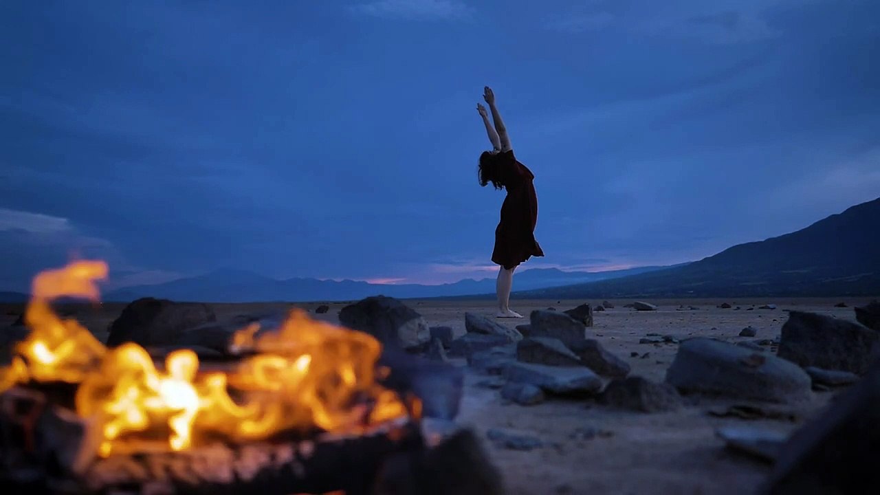 Api unggunmaixkit-deserted-plain-with-a-campfire-and-a-woman-practicing-yoga-32764-medium