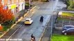 Moment a hapless thug falls off his scooter - while trying to kick a police car