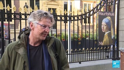 Climate activist glues his head to Vermeer's painting "The Girl with a Pearl Earring"