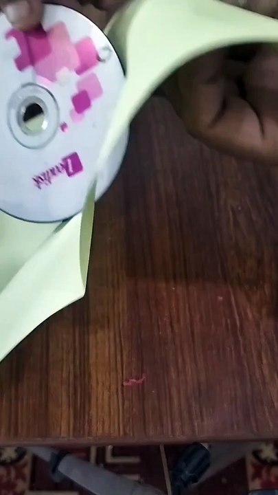 how to pass a cd from the center of a paper.