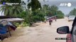 Flooding swamps villages after tropical storm hits Philippines