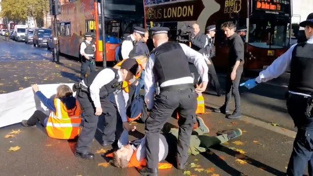Police drag Just Stop Oil activists off road near Downing Street amid latest protest