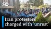 Iran vows tough stance on dissent in public trials