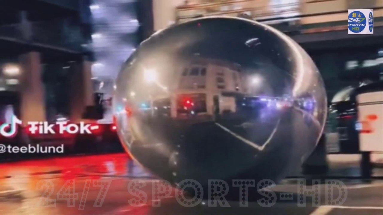 Incredible Moment- Giant Christmas Baubles Bigger than Cars Roll Down London Street after High Winds