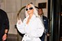Kim Kardashian Traded in Her Go To Style for a White Trench Coat and the Tallest Over the