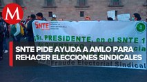 Trabajadores de la SNTE protestan en el Zócalo de CdMx por elecciones