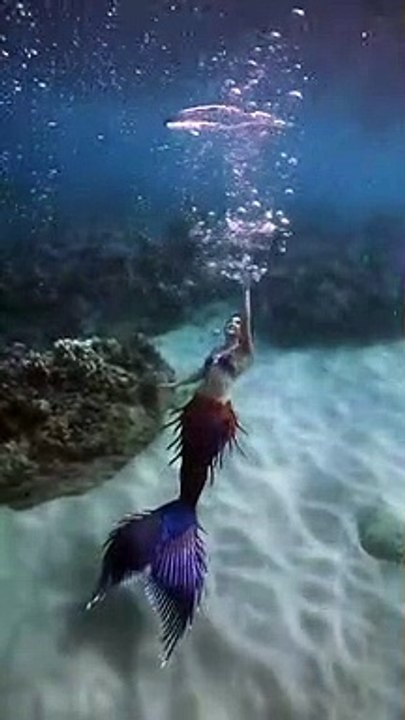 Blowing bubble rings underwater as a real life mermaid