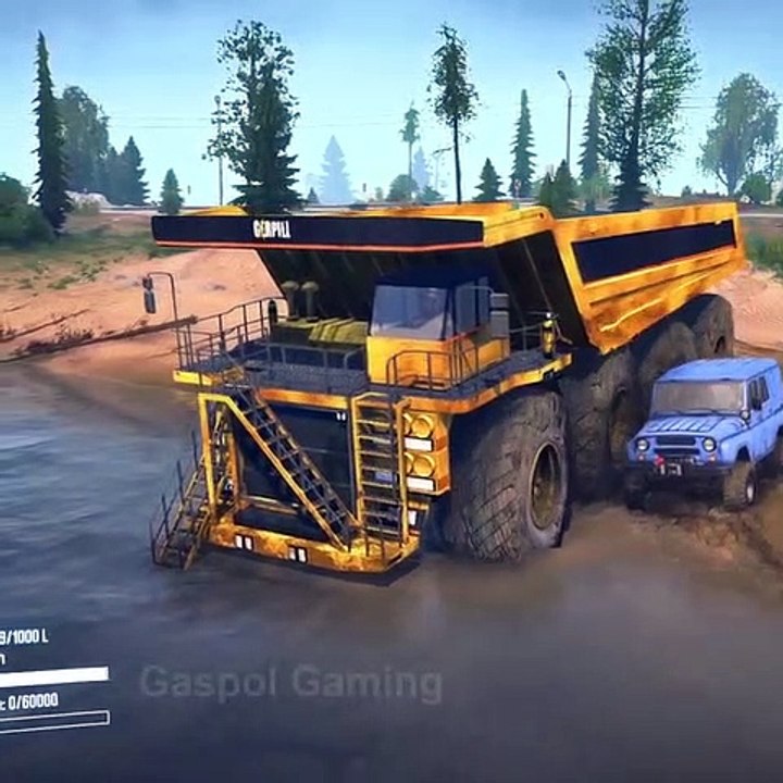 Caterpillar truck stuck in deep river