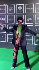 Ranveer Singh can't take his eyes off Deepika Padukone as they pose together at an awards event