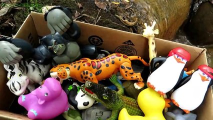 Box filled with various Zoo Animal Toys.